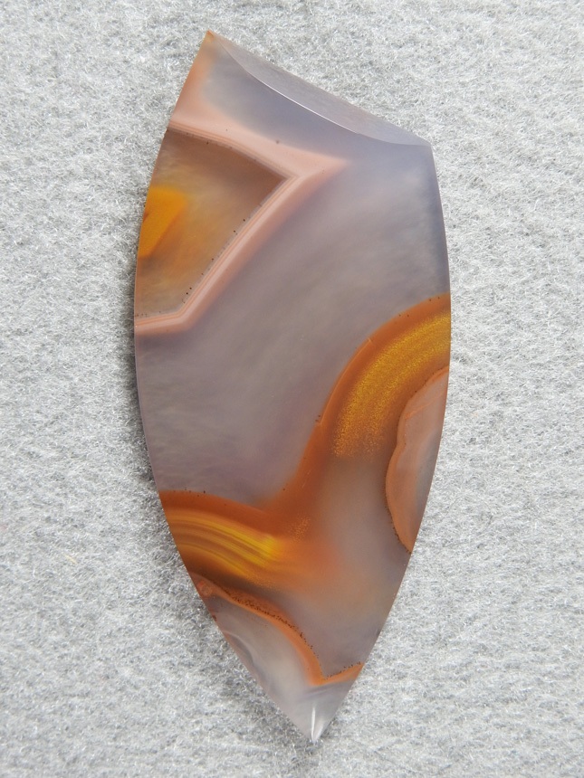Apache flame agate 313  :  Very elegant cab!  This has a lot of color and the cut accentuates it.  A mirror polish on this and definately a collectors piece.