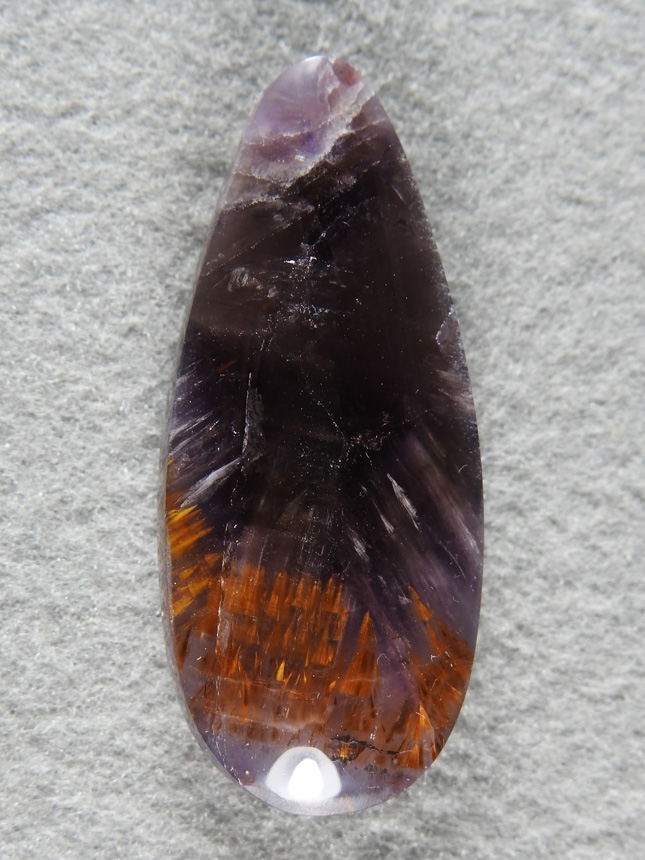 Cacoxenite Amethyst 2039 : A rich Purple Amethyst teardrop with Golden Cacoxenite sprays lining the bottom.