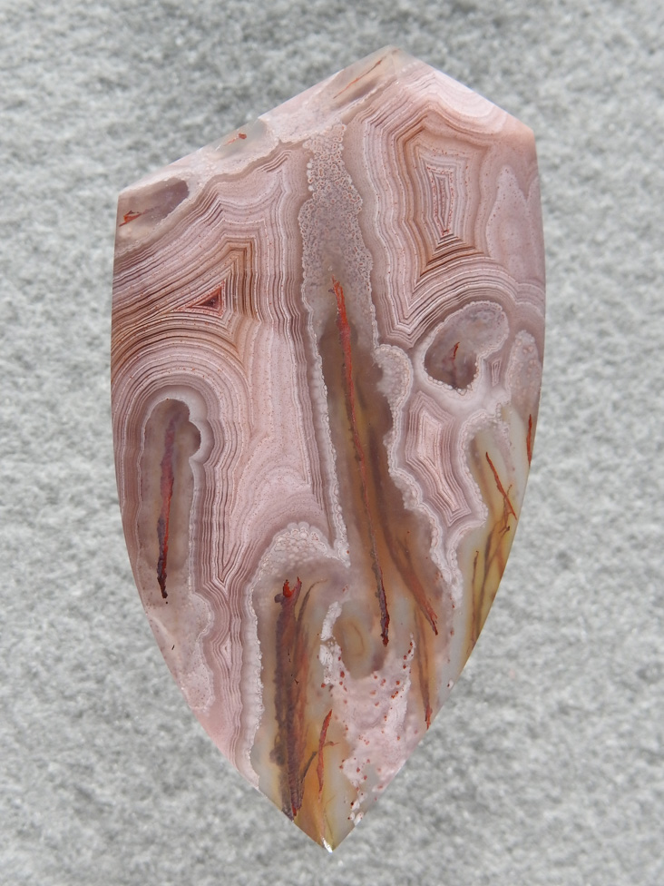 Coyamito Agate 202  :  I was given 4 slabs of this exotic color Coyamito to cut and the patterns and tubes combined with the Pink and Brown colors to make some striking cabs. Amazing Shadow Agate too.