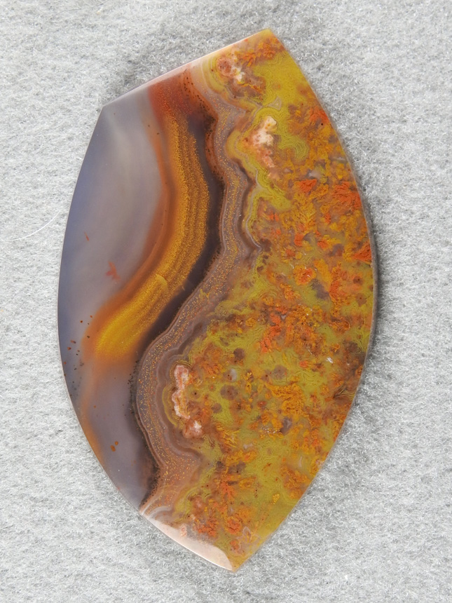 Apache Flame Agate 1893  :  A Nice large Collector cab with the classic ribbons and a field of Plume in a Yellow field.