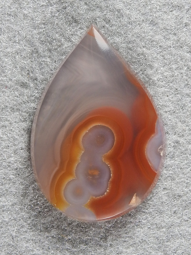 Coyamito Agate 214  :  A small tear drop of Coyamito Agate That captured that remind me of a roiling fire.  I can see this in a necklace so easilly.