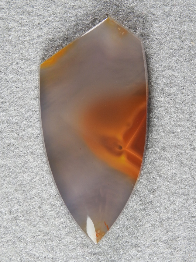 Apache Flame Agate 304  :  A great Apache Flame Aggate with the tip what looks like a psuedomorph inside that really shows off the depth in this material.