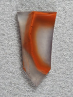 Apache flame agate 305  :  Even the trimmings on the Apache are great.  So much pattern in Apache it all gets used.  A small stone very suitable for a pendant.