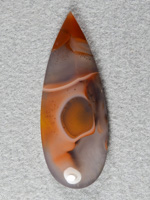 Apache flame agate 318  :  This is a cool cab, the center White, Yellow and Orange area resembles a Crab Claw (look at it sideways).