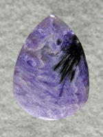 Charoite 553  :  I got this little piece of charoite in a mixed box of odds and ends for a couple bucks.  This shows the nice black crystal sprays that set off this material.