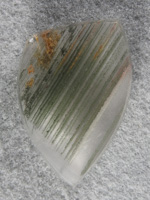 Chlorite Quartz 1797 : Chlorite bands from phantom inclusions in this Quartz cab.