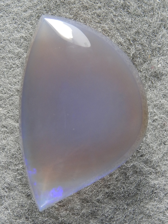 Fire Opal 1733 : Blue Hydrophane Opal With some Blue glow in the center and Blue flahes at bottom corner.