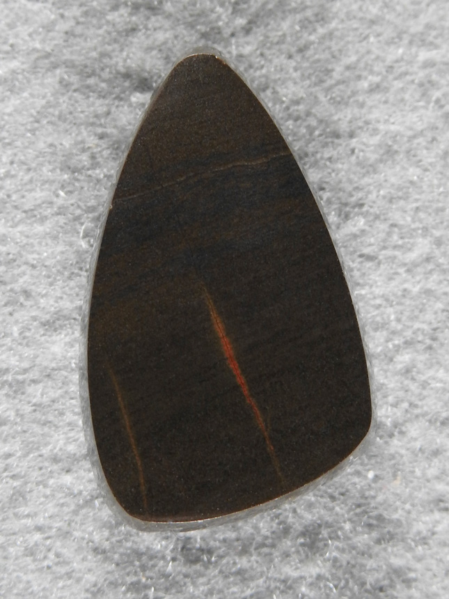 Jasper 1873 : I called is Jasped but who knows, very dark material with a Orange line running up it.