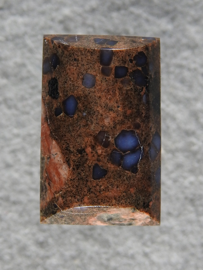 Llanite 564  :  A pretty little cab of some material my friend sent me.  The feldspar in this host flashes a neon Blue color.