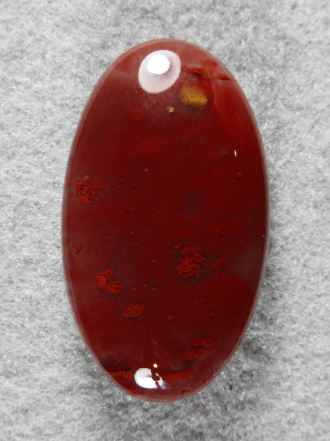 Pigeon Blood Agate 527  :  A pretty shallow ellipse of Pigeon Blood Agate from Green river Utah.  Only made it there once but I want to go back.