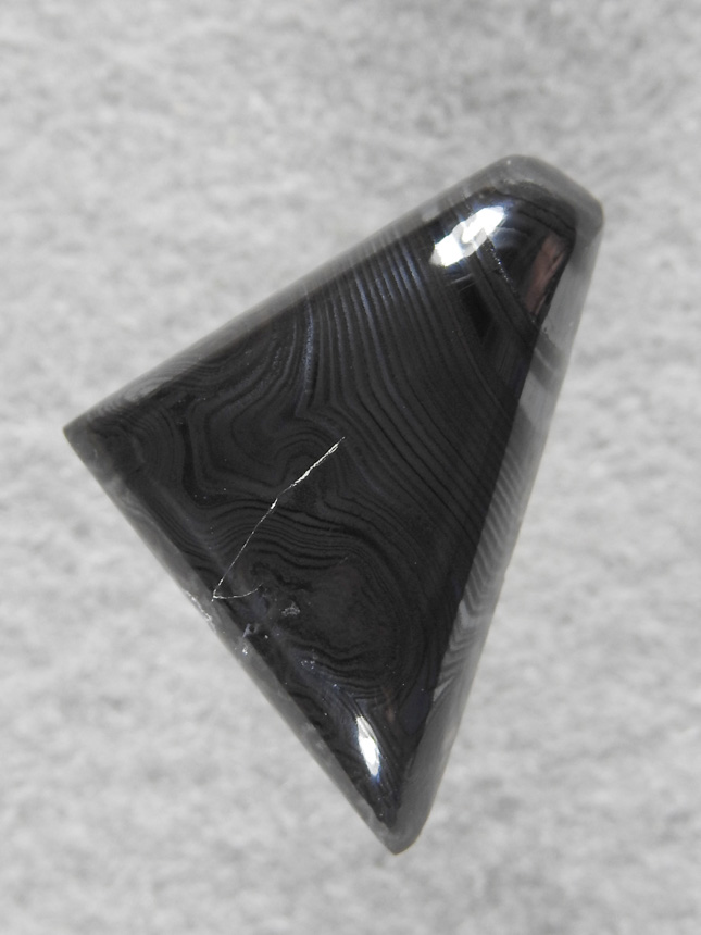 Psilomelane 2150 : Crown of Silver Psilomelane.  Hard to phograph the very nice bands in this cab.