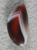 Botswana Agate 1760 : I just love Botswanas when they have the plum or reds inside.  Strong pattern and would make a nice earring to go with 1761.