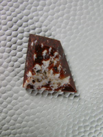 Cady Mtns Agate 599  :  North Cady White Plume in Red Agate.  A  small stone but was playing with the patterns you get by cutting thru the plumes.