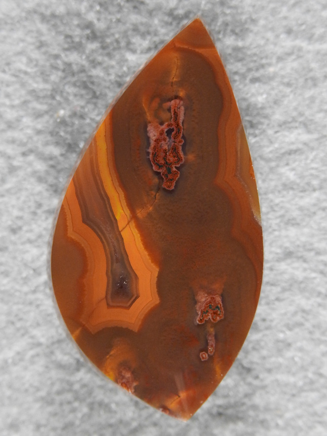 Condor Agate 1777 : A smaller pendant cab of rich Orange and Brown Condor Agate.  This material always takes a mirror finish.