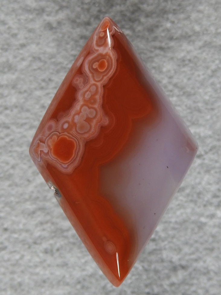 Coyamito Agate 146  :  This cab wouldn't have been so nice without those great spots across the top.  Very pretty.