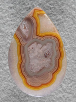 Coyamito Agate 155  :  A nicely filled Pseudomorph in a crisp bright lines.  Your eye travels to this stone in a crowded page.