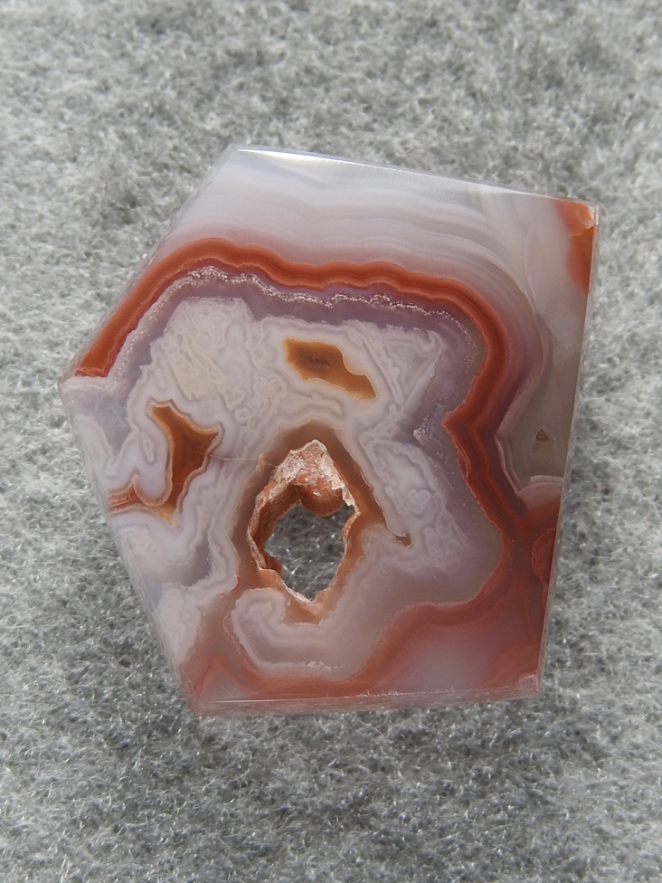 Coyamito Agate 1472 : A cross section of an aragonite pseudomorph.  Cut the geometric to follow the lines.