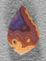 Coyamito Agate 1478 : Holy cow is this a bright Coyamito!  Purple, Reds, Yellows. Cab takes full advantage of the pattern don't you agree?
