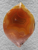 Coyamito Agate 194  :  A very subtle cab, very gemmy with some nice bubbles under the surace at the top of the cab, probably tips of Sagenite needles.