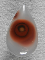 Coyamito Agate 196  :  I bought a couple pieces of rough after carefully going thru the Coyamito tray at the dealer.  Careful cutting on angle produced this eye and I should get one more similar.
