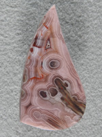 Coyamito Agate 201  :  I was given 4 slabs of this exotic color Coyamito to cut and the patterns and tubes combined with the Pink and Brown colors to make some striking cabs. Amazing Shadow Agate too.