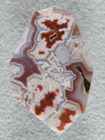 Coyamito Agate 209  :  A tall and large cab of exceptional Psuedomorph Agate from Coyamito.  A wonderful color combo and intense Reds make this a beautiful cab.