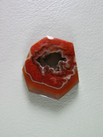 Coyamito Agate 210  :  A cab of exceptional Psuedomorph Agate from Coyamito in Cherry Reds. The cab follows the negative left by the Aragonite crystal form nicely, perfect for a pendant