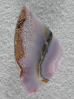 Coyamito Agate 215  :  I cut many cabs of this beautiful Purple Agate.  The Black band and almost poppy texture towards the outter bands really makes very nice cabs.