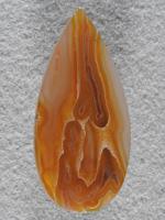 Coyamito Agate 217  :  One of a couple pieces of rough I bought that ranged from 3 to 6 dollars.  Slabs didn't look that great but just find the pictures within.  These tubes caught my eye. 