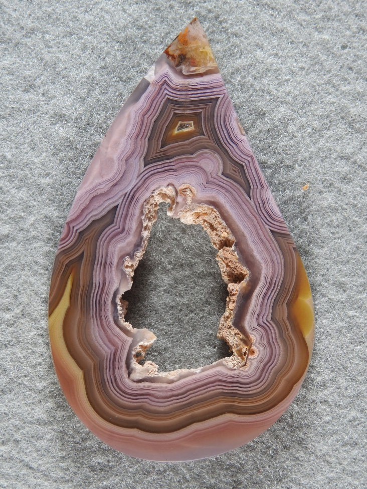 Coyamito Agate 1880  : I decided utilize the hollow from a pseudomorph and play on it in the shape of the cut.  It turned out amazing.