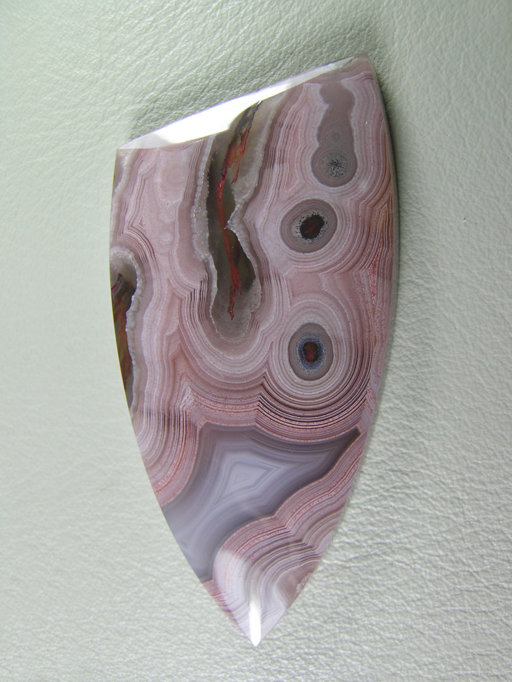 traded Coyamito Agate 238T  :  I was given 4 slabs of this exotic color Coyamito to cut and the patterns and tubes combined with the Pink and Brown colors to make some striking cabs.