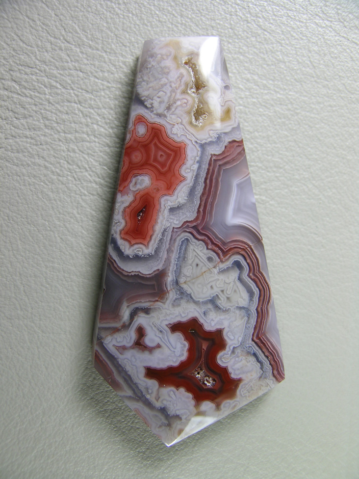 traded Coyamito Agate 239T  :  An exceptional Psuedomorph Agate from Coyamito.  A wonderful color combo of Orange and Reds make this a beautiful cab.