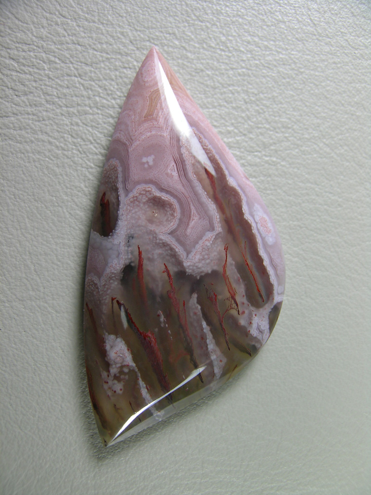 traded Coyamito Agate 240T  :  I was given 4 slabs of this exotic color Coyamito to cut and the patterns and tubes combined with the Pink and Brown colors to make some striking cabs.