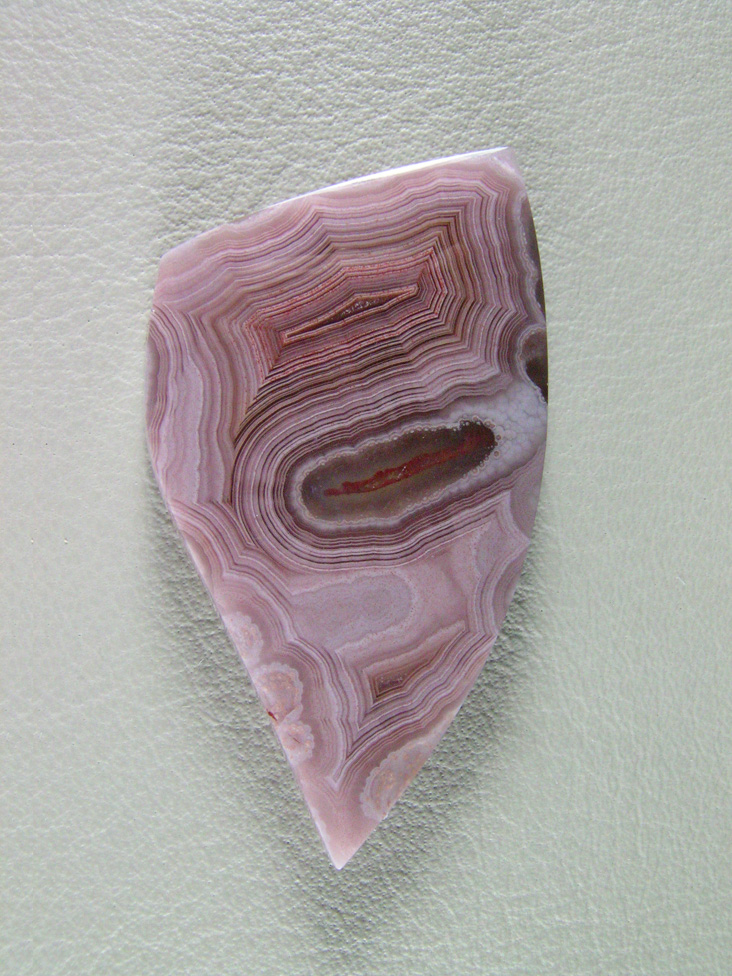traded Coyamito Agate 245T  :  I was given 4 slabs of this exotic color Coyamito to cut and the patterns and tubes combined with the Pink and Brown colors to make some striking cabs.
