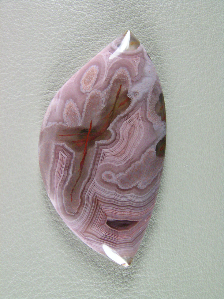 traded Coyamito Agate 246T  :  I was given 4 slabs of this exotic color Coyamito to cut and the patterns and tubes combined with the Pink and Brown colors to make some striking cabs.
