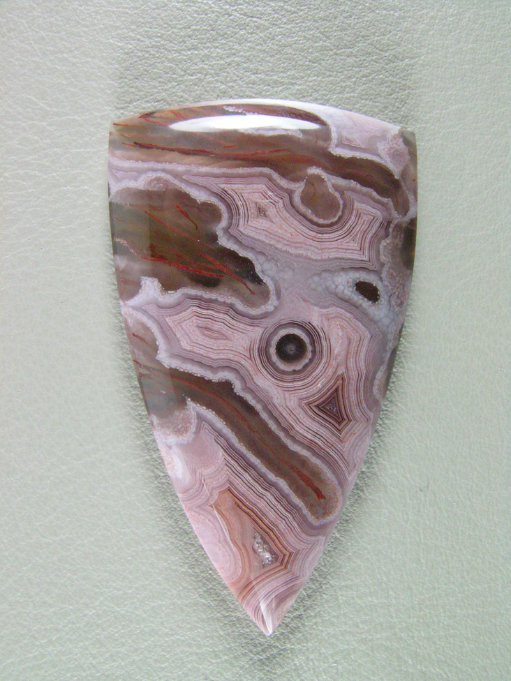 traded Coyamito Agate 247T:  I was given 4 slabs of this exotic color Coyamito to cut and the patterns and tubes combined with the Pink and Brown colors to make some striking cabs.