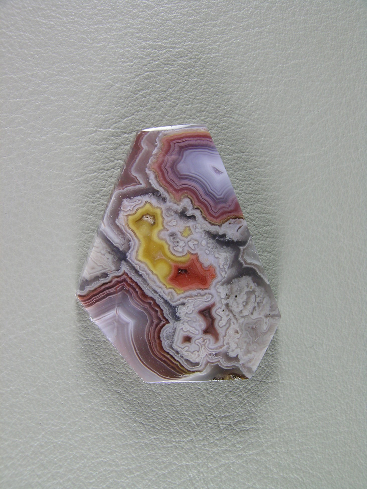 traded Coyamito Agate 249T  :  A small cab of exceptional Psuedomorph Agate from Coyamito.  The color combo of Yellow and Red make this a striking cab.