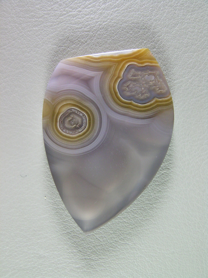 traded Coyamito Agate 251T  :  Another excellent example of this Gold and Clear Tube Agate from Coyamito.  Transparent with eyes and a set of wites balls floating in the clear.