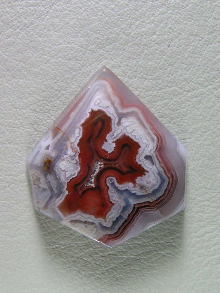 traded Coyamito Agate 254T  :  A cab of exceptional Psuedomorph Agate from Coyamito.  A wonderful color combo and intense Reds make this a beautiful cab.  Perfect for a pendant