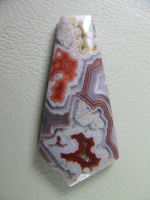 traded Coyamito Agate 239T  :  An exceptional Psuedomorph Agate from Coyamito.  A wonderful color combo of Orange and Reds make this a beautiful cab.