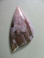 traded Coyamito Agate 240T  :  I was given 4 slabs of this exotic color Coyamito to cut and the patterns and tubes combined with the Pink and Brown colors to make some striking cabs.