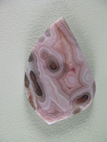 traded Coyamito Agate 243T  :  I was given 4 slabs of this exotic color Coyamito to cut and the patterns and tubes combined with the Pink and Brown colors to make some striking cabs.