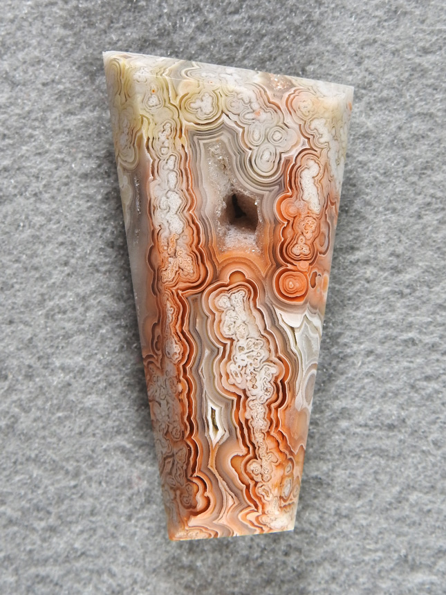 Crazy Lace Agate 689  :  Great color and striking pattern in the geometric cab.  Designed around the druzy center.