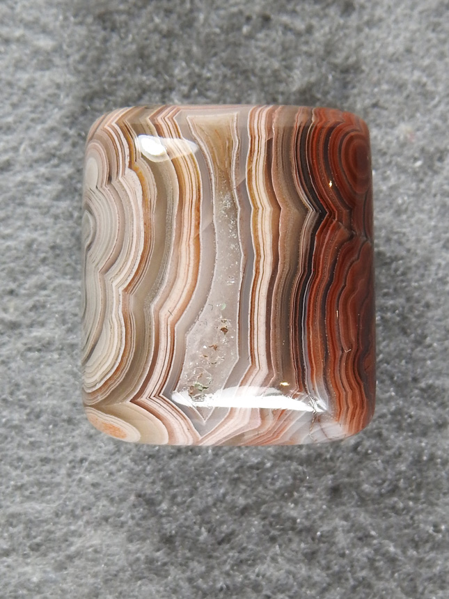 Crazy Lace Agate 694  : A small ring stone with contrasting sides.