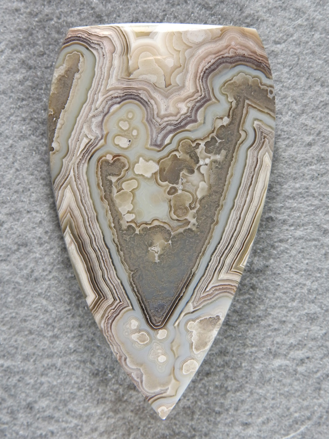 Crazy Lace Agate 698  :  The picture does not do this cab justice.  I don't think I have seen such a beautiful pastel Green in Crazy Lace before and then this large Crystal replacement made the shape of this cab a no brainer.  This is a collector cab.