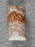 Crazy Lace Agate 692:  I love the Oranges framing the needles in these Crazy Lace stones.  A half barrel cut here with a great pattern.