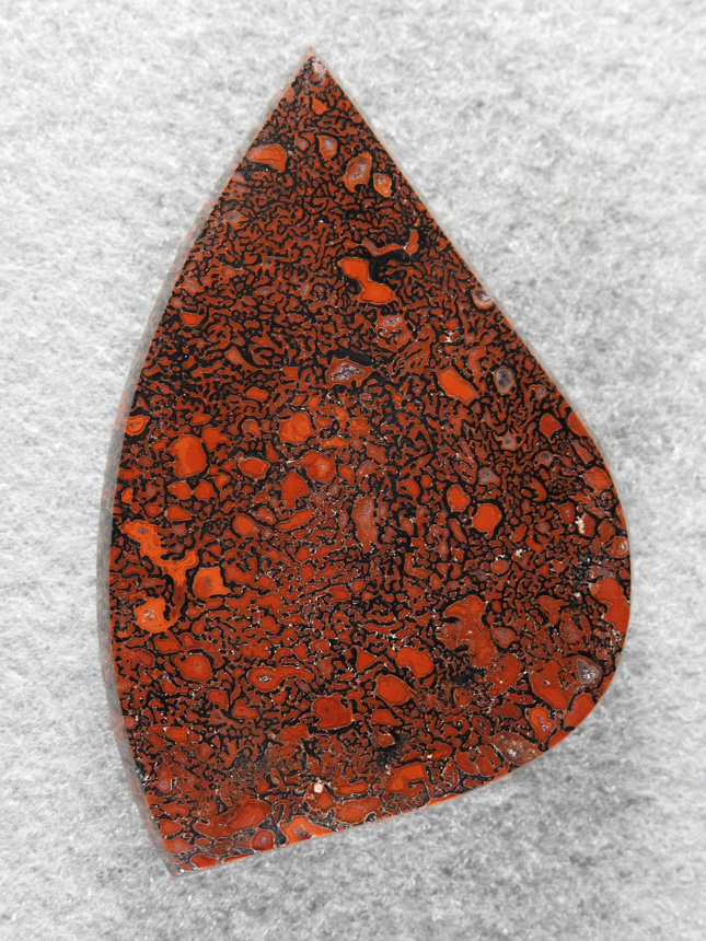 Dinosaur Bone 1506 : Gemmy Bone with contrasting light and dark Red cells.  A deep Radius cut.