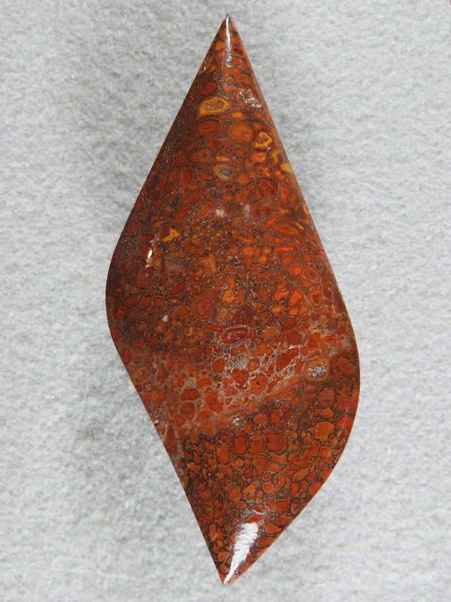Dino Bone 358  :  A huge cab of Black, Brown Red Orange and Yellow.  Sharp points both ends and a high polish.