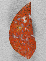 dino bone 376  : A very bright red in this bone with a lemon Yellow spot in center.  This material took a very high polish.