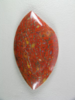 traded Dino Bone 409T  :  Such a bright Red Orange color.  There were 2 slabs of this bone and some great cabs as a result.  This stone also features some nice Yellow accents.